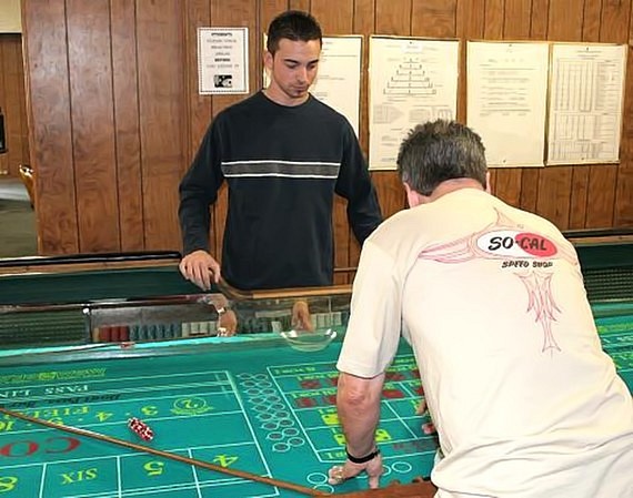 Nick checks the craps table layout